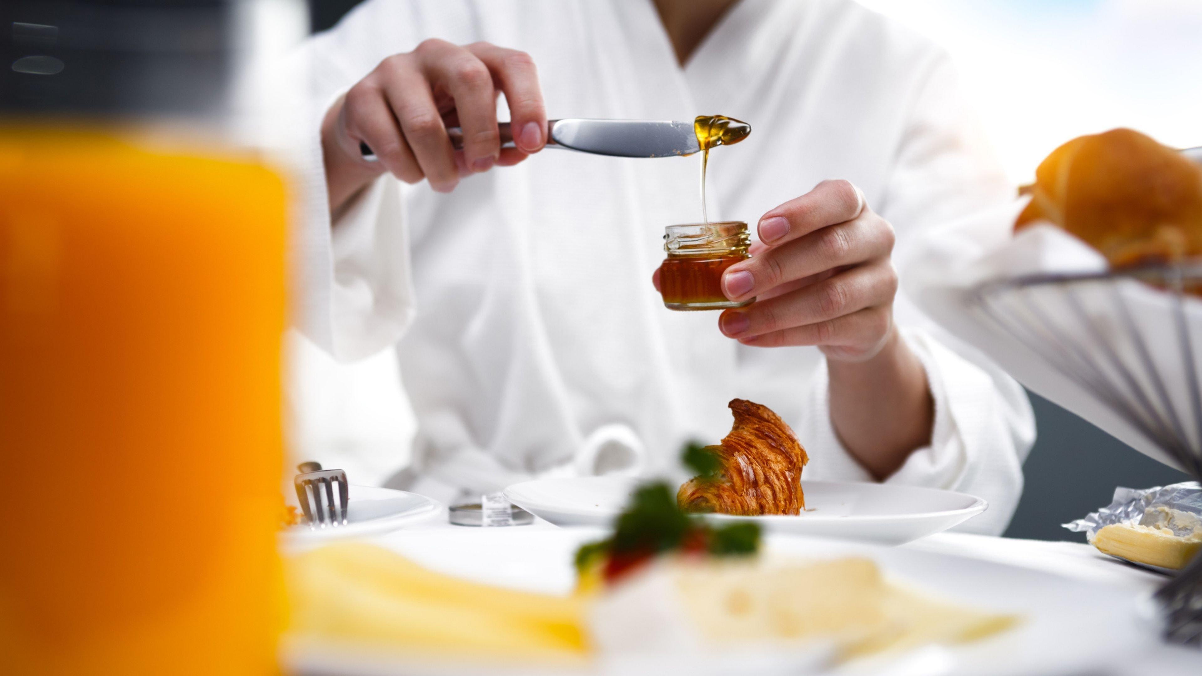 Intercontinental Sydney By Ihg Hotel Exterior photo Honey being drizzled onto a croissant
